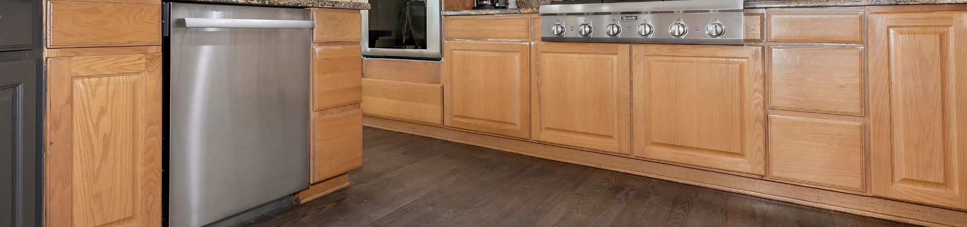 Photo of kitchen old dark brown stained cabinets